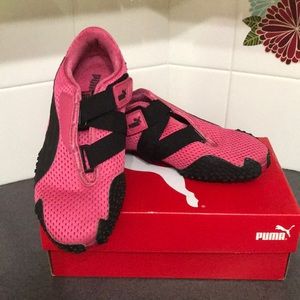 Pink puma athletic shoes